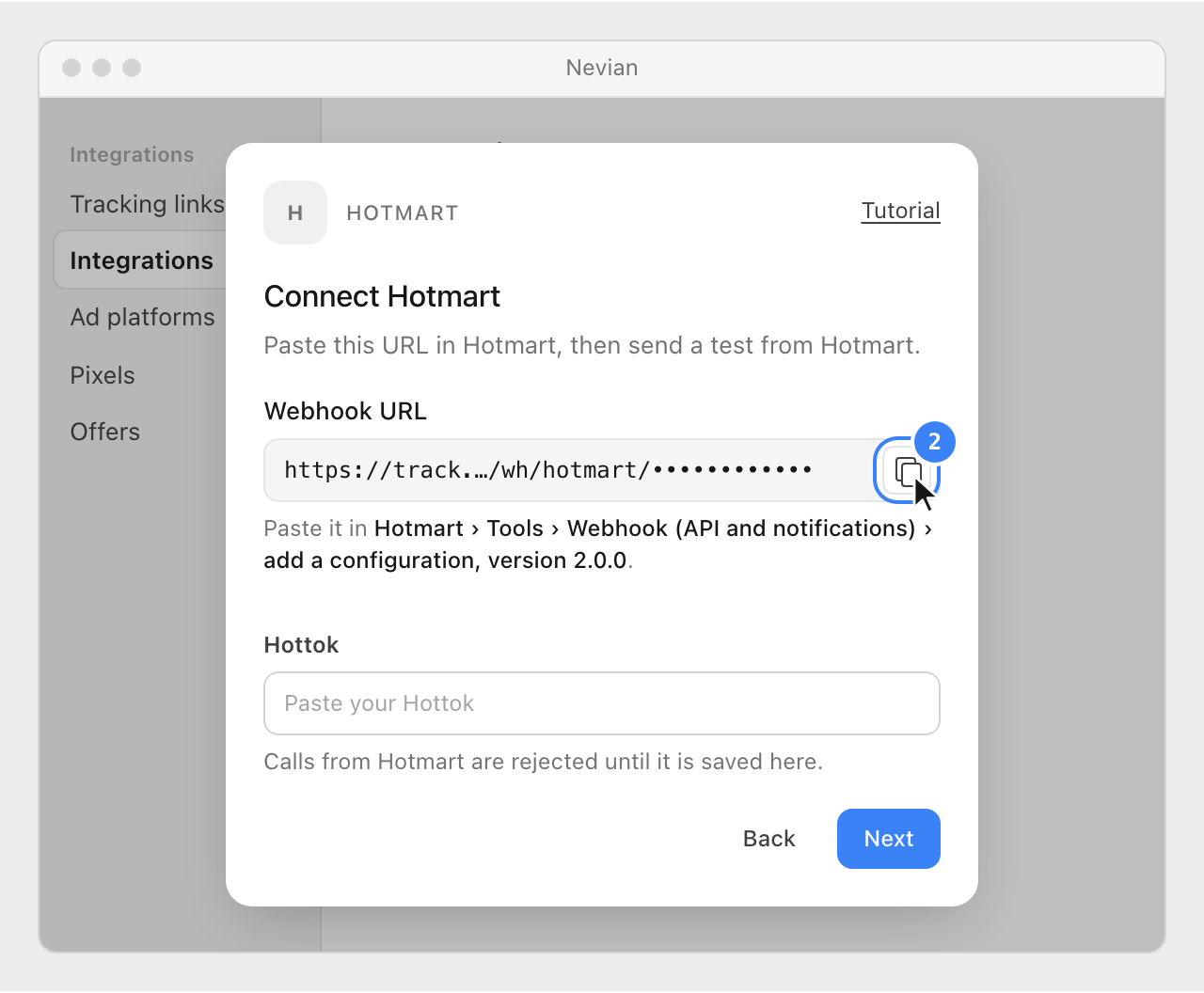 The Webhook URL in the Connect Hotmart window, with its copy button highlighted and the empty Hottok field below.